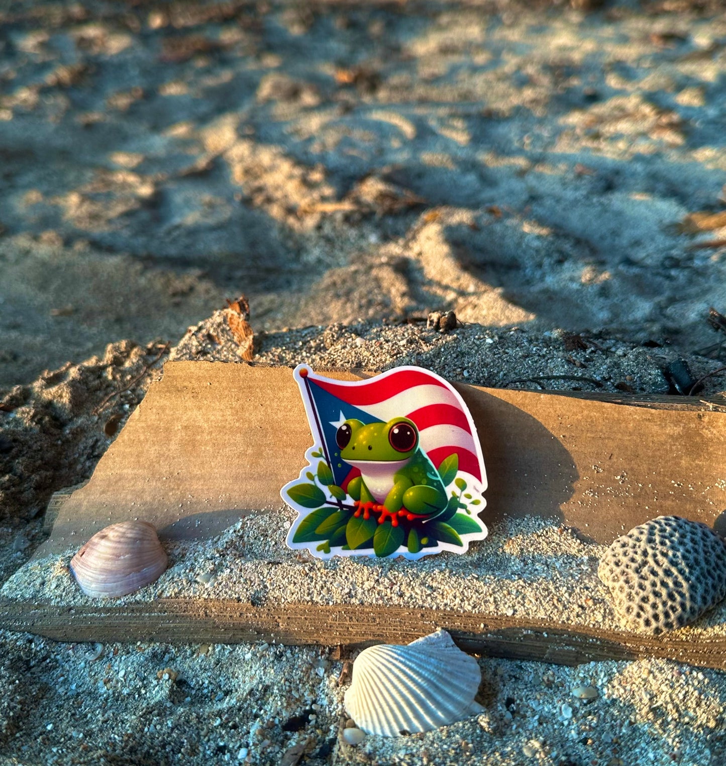 Coquí en hoja con bandera 🐸🇵🇷